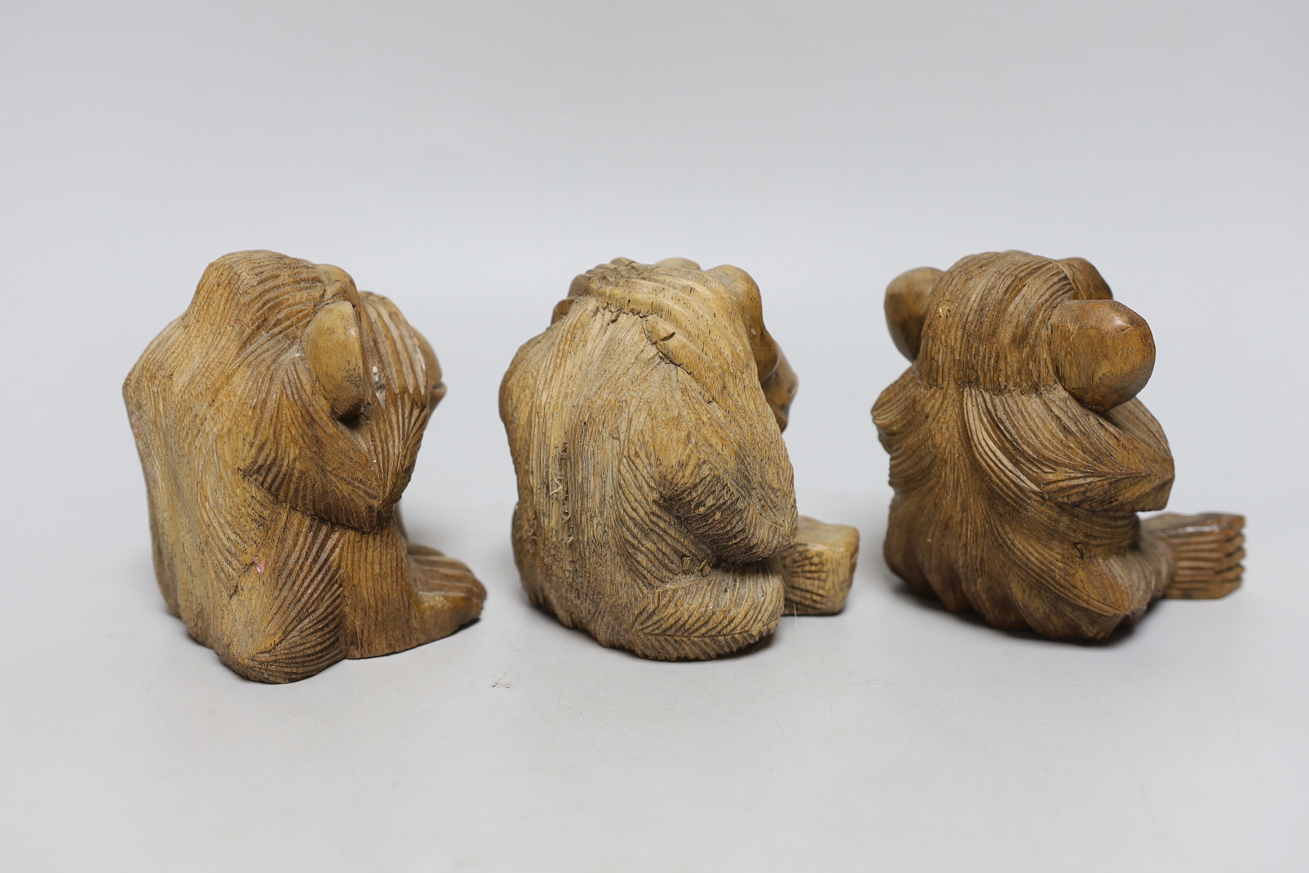 Three carved wood monkeys - hear no evil, see no evil and speak no evil, 10cm tall